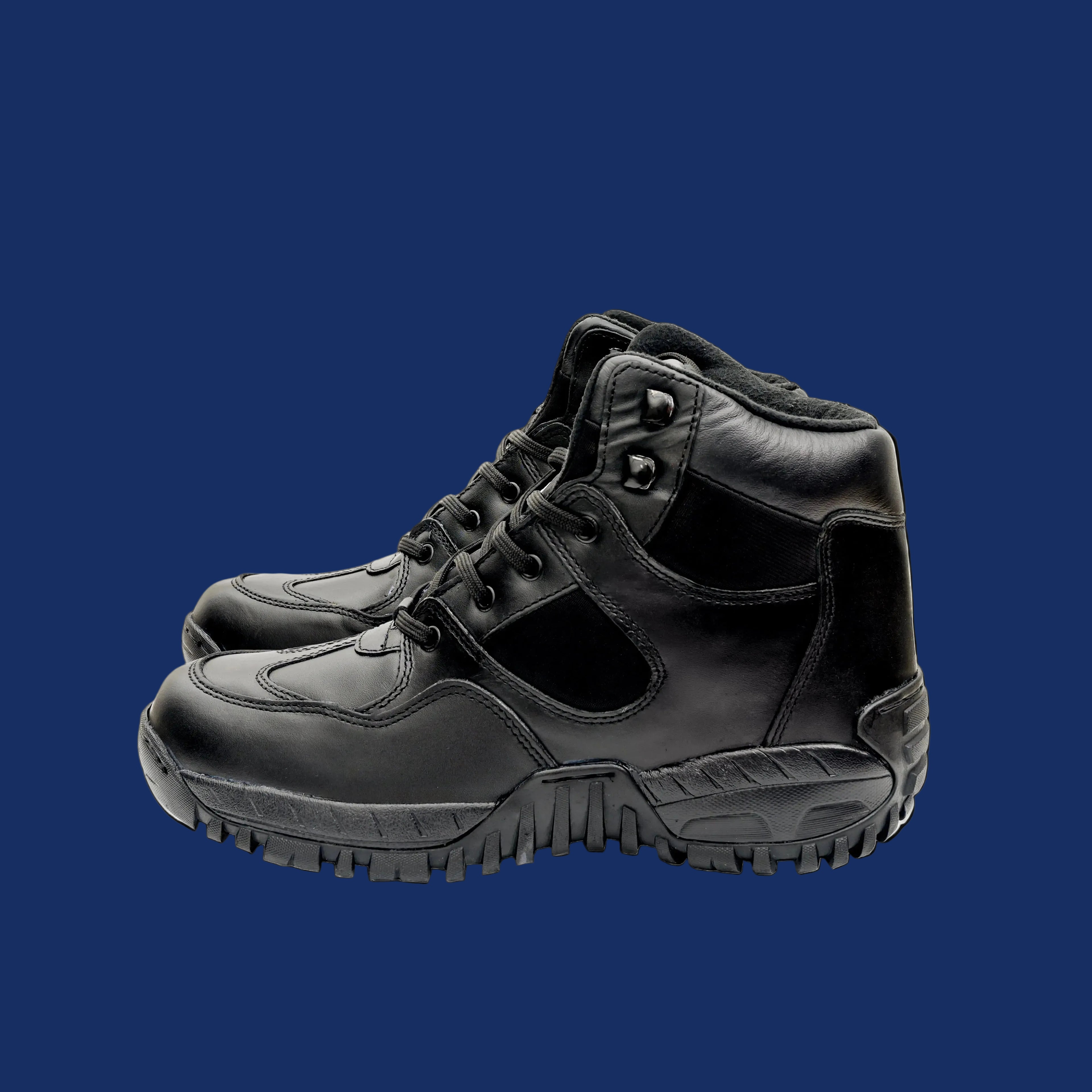 Pair of black leather boots on a white background